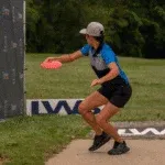 Pro Disc golfer teeing off at Idlewild