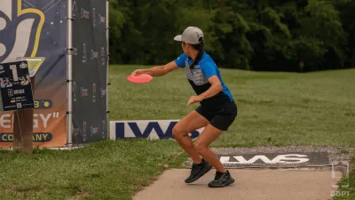 Pro Disc golfer teeing off at Idlewild